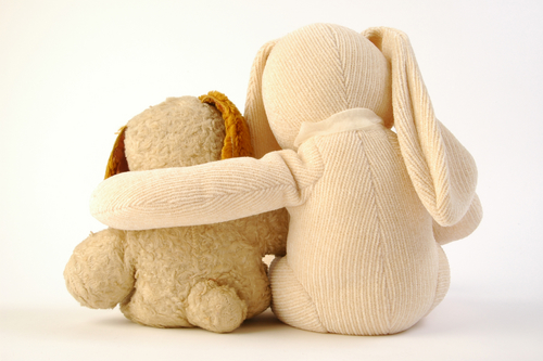 rabbit hugging stuffed animal