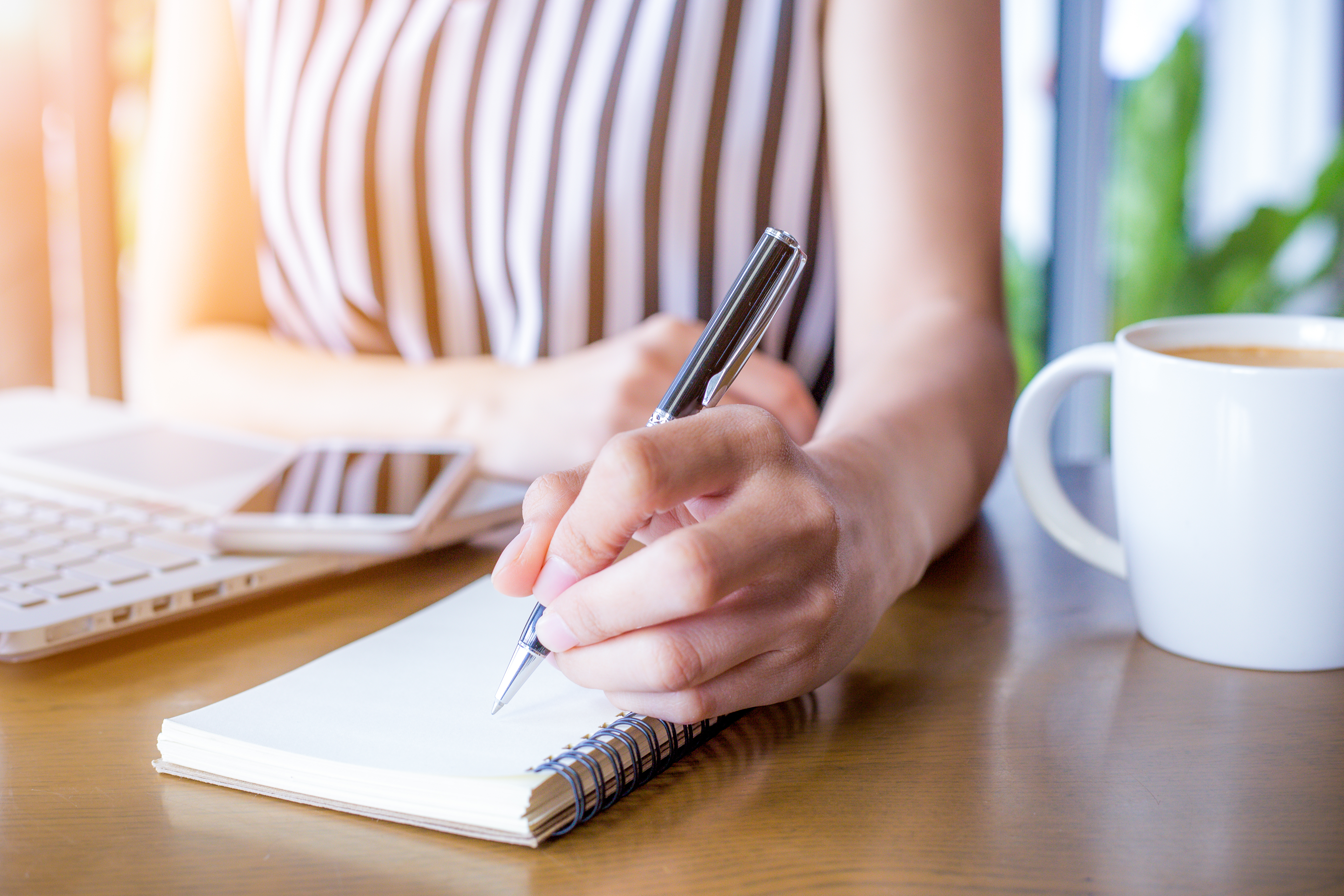 person taking notes person taking notes