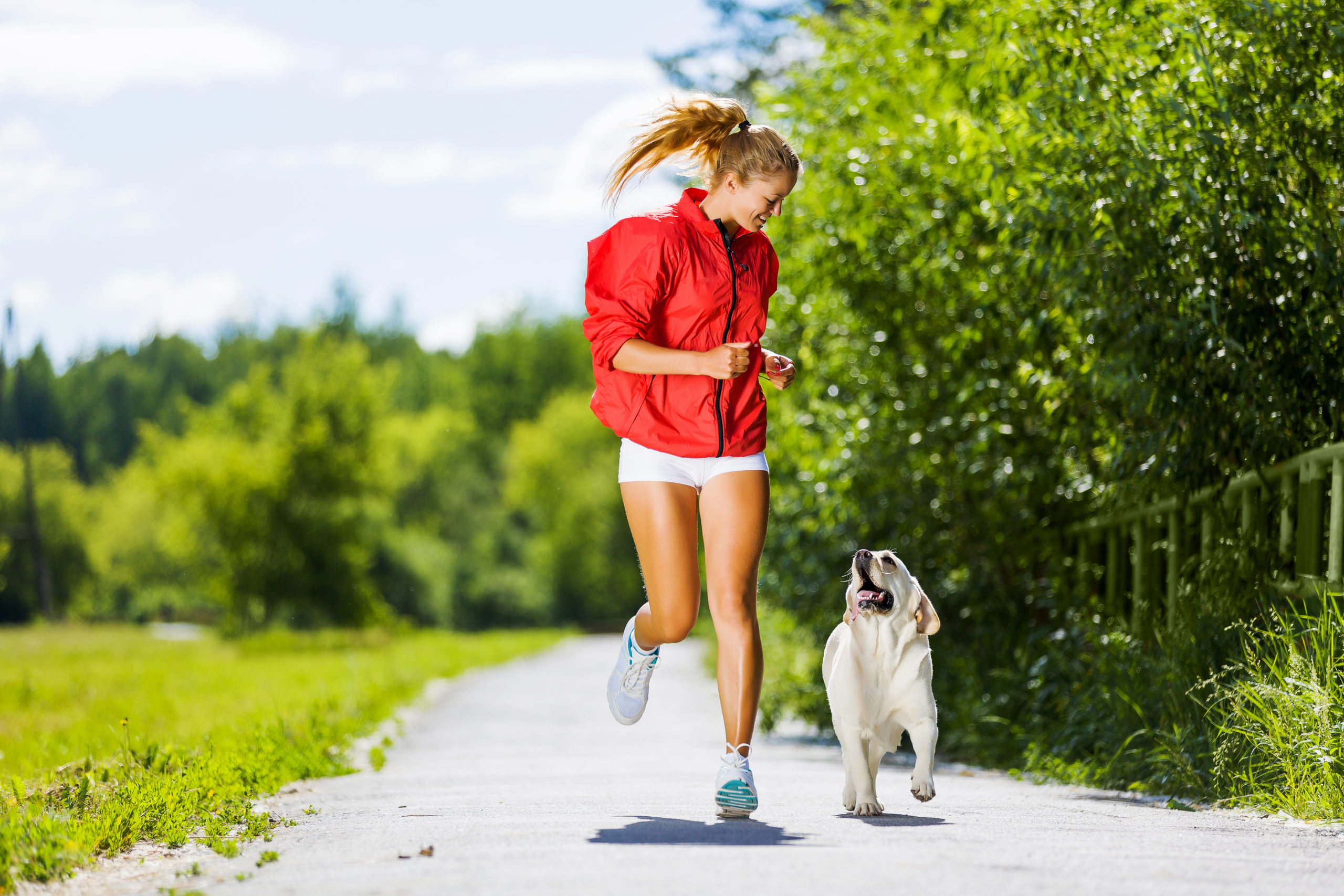 Lady running with her dog